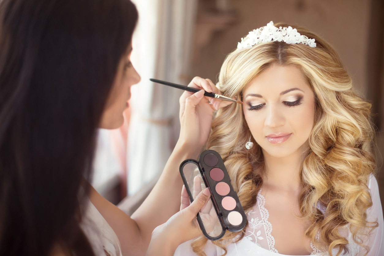 Bridal makeup being applied at a salon